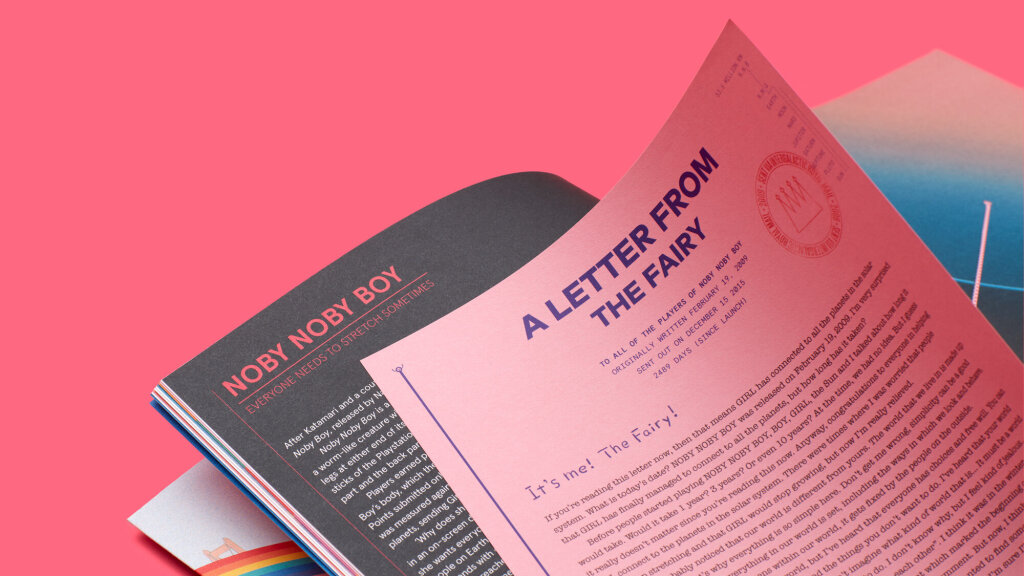 A photograph spread of issue 2 of A Profound Waste of Time featuring a letter from the fairy from Keita Takahashi's game Noby Noby Boy.